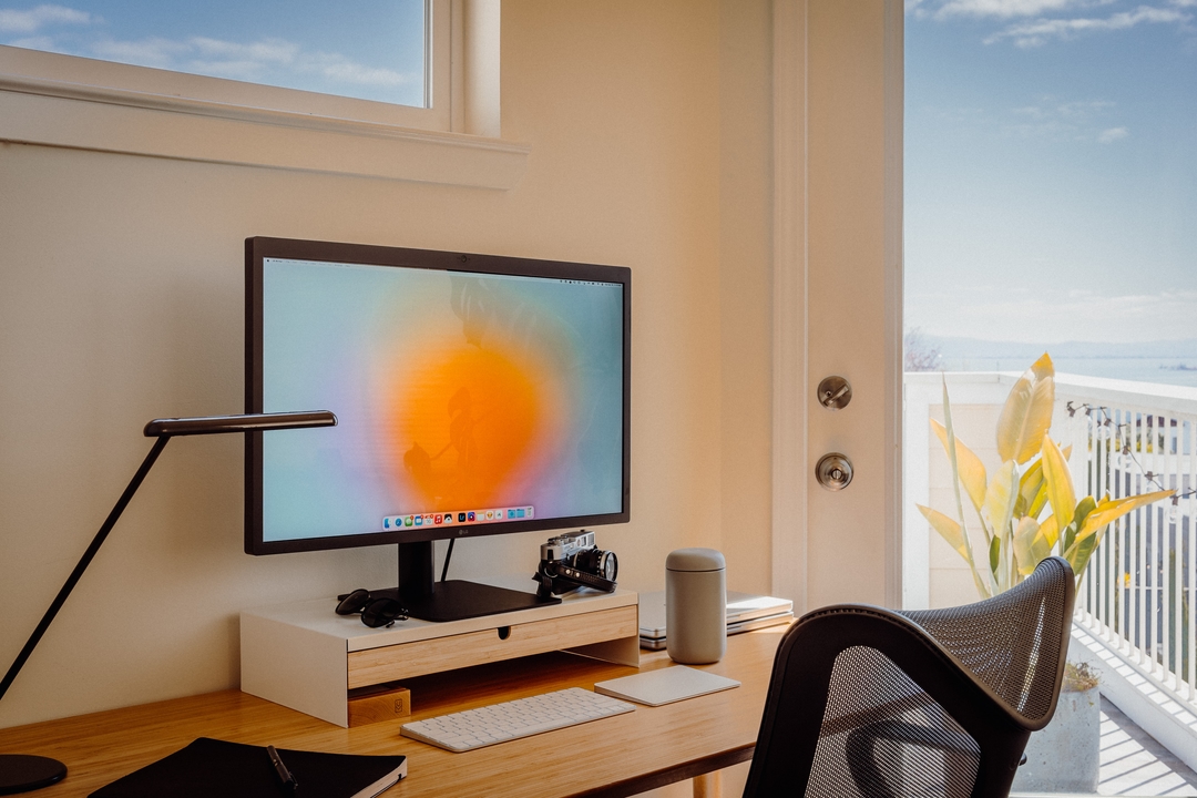 Picture of a desk with a monitor, a film camera