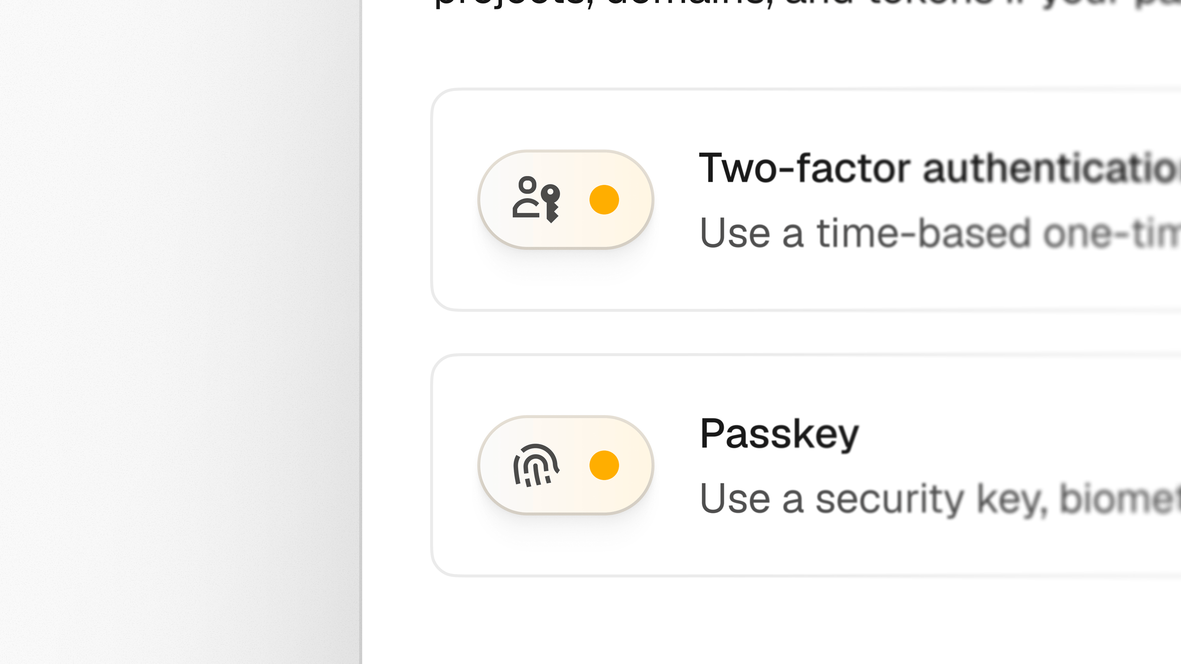 Close-up of the two-factor authentication and passkey row items with their yellow-accented icon pills
